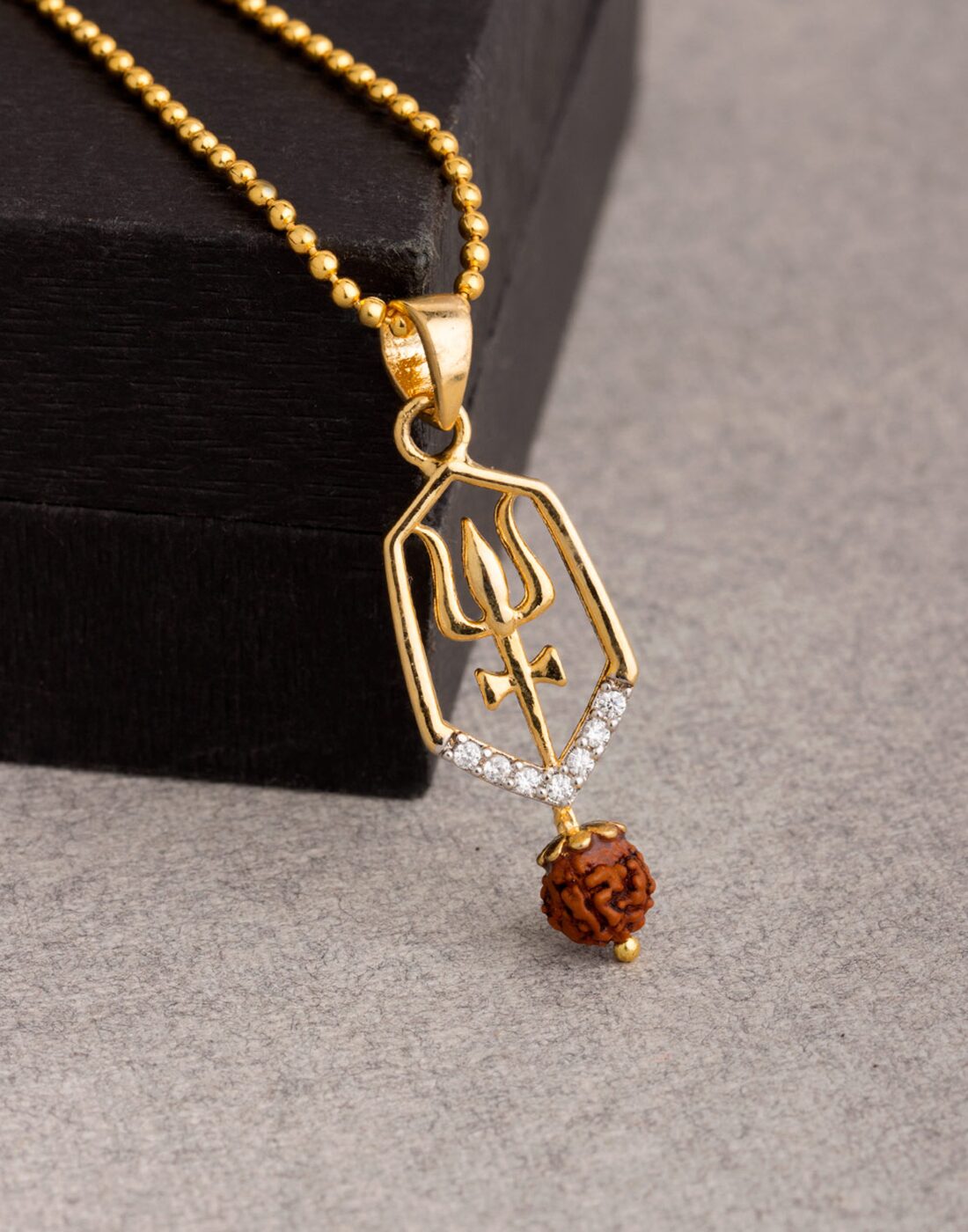 Dare by Voylla Trishul Engraved Rudraksha Studded Pendant With Chain For Men
Dare by Voylla Trishul Engraved Rudraksha Studded Pendant With Chain For Men