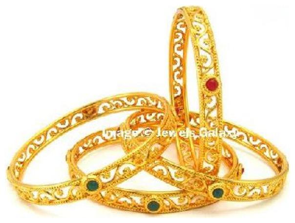 Jewels Galaxy Exclusive Gold Plated Circular Shaped Red Green Stone Bangles For Women
Jewels Galaxy Exclusive Gold Plated Circular Shaped Red Green Stone Bangles For Women