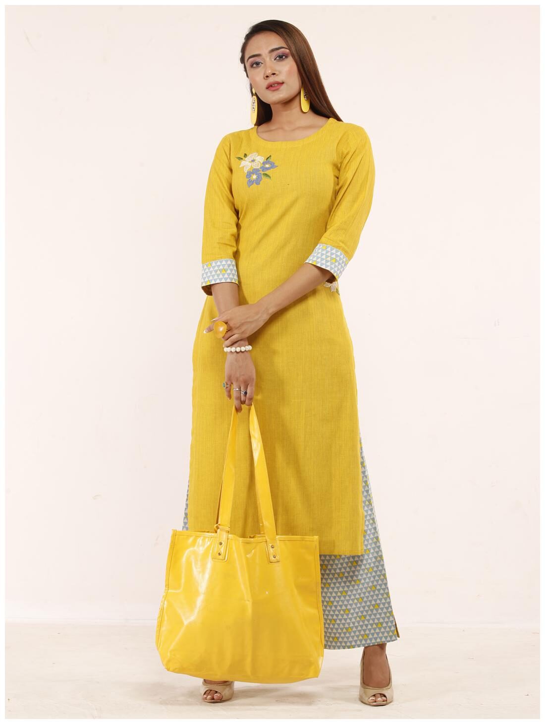 

Anvita Women Mustard Embroidered Stitched Suits