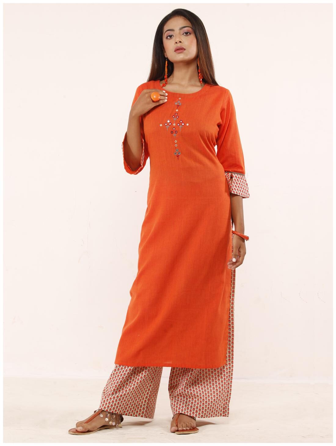 

Anvita Women Orange Cotton Embroidered Stitched Suits