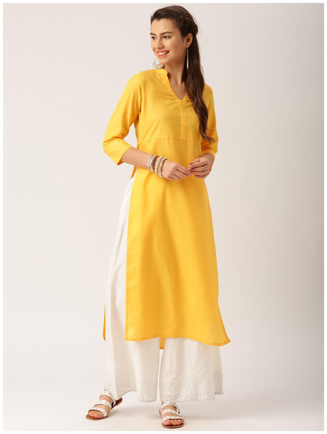 

Jaipur Kurti Women Yellow Solid Straight Kurti