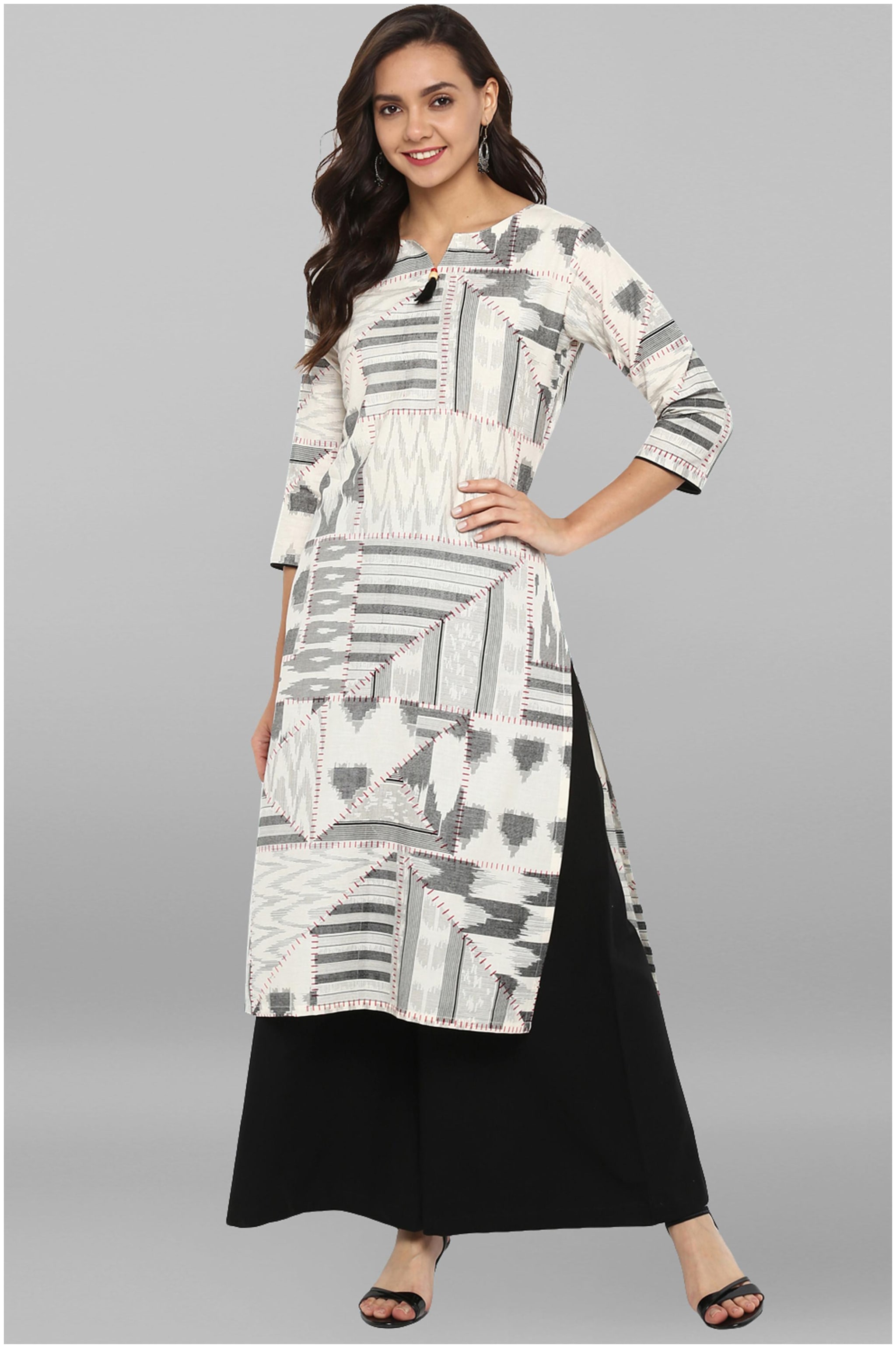 

Janasya Women Off White Black Printed Straight Kurta With Palazzo