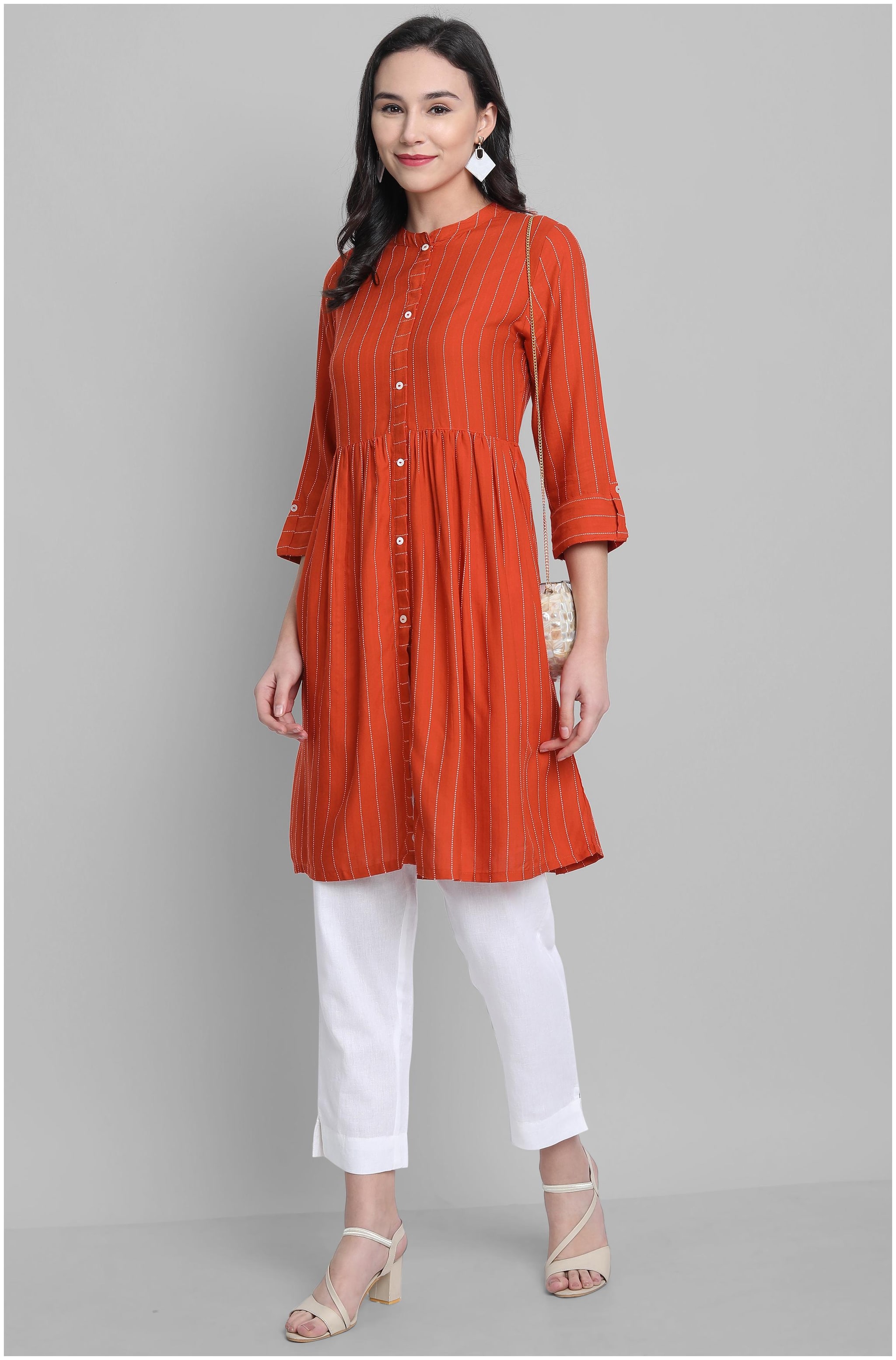 

Janasya Women Orange Striped Fit and Flare Kurta