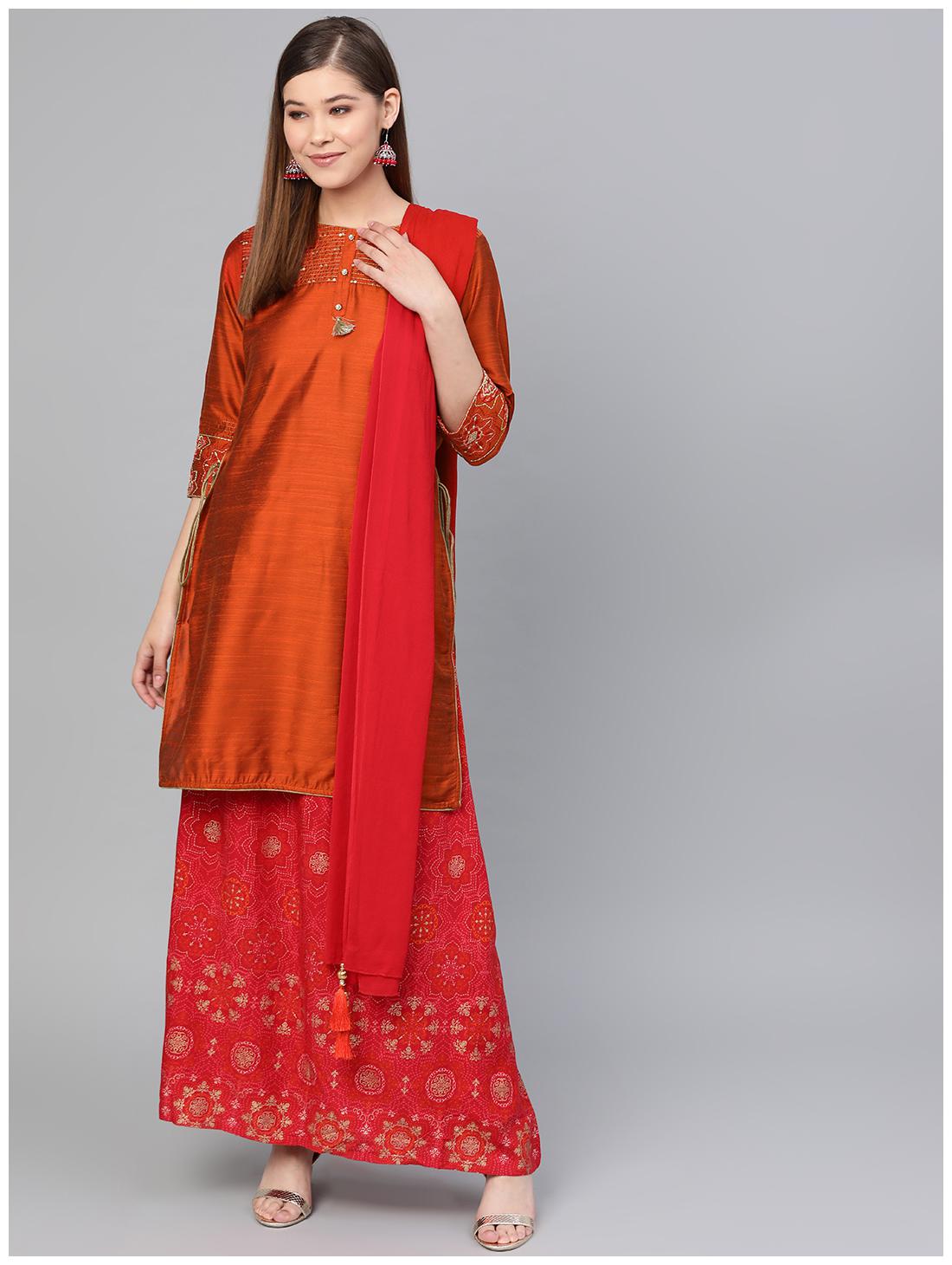 

Shree Women Orange Solid Straight Kurta With Skirt And Dupatta