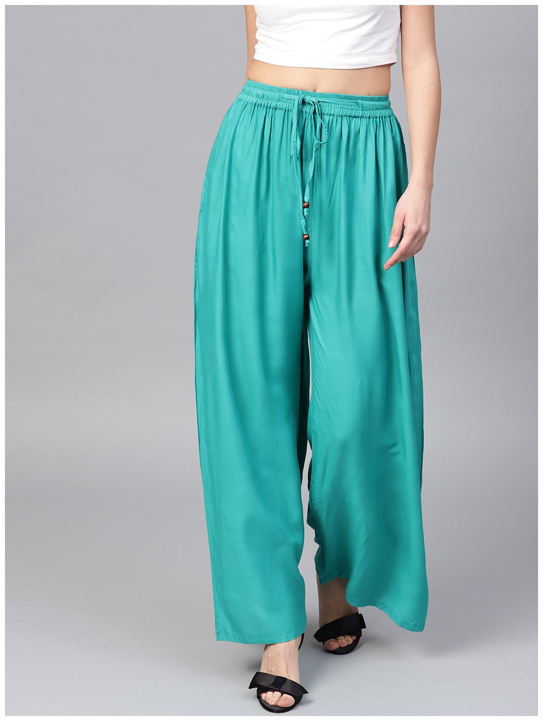 

AASI- HOUSE OF NAYO Blue Solid Flared Palazzo