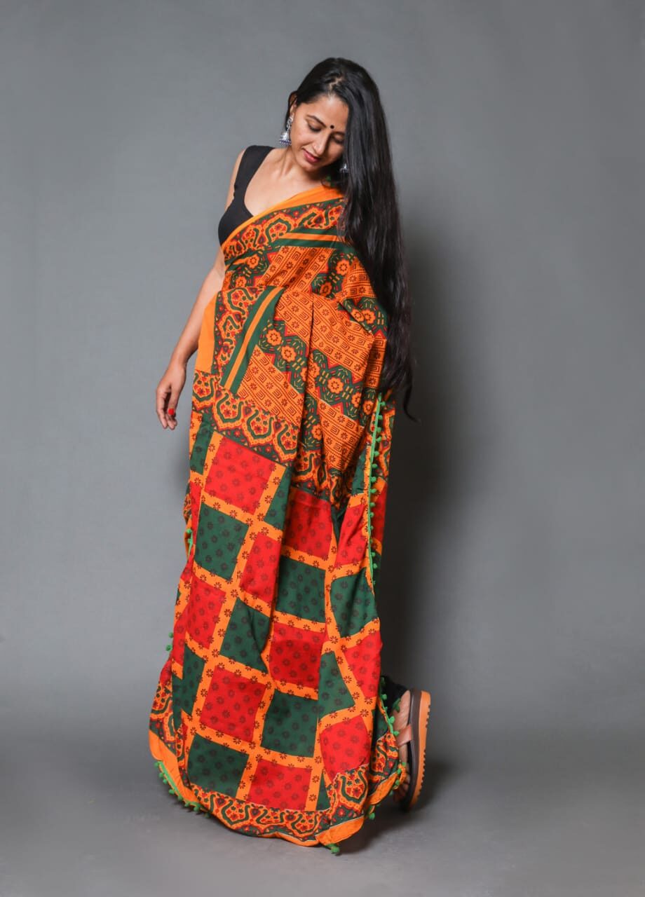 

Yogine Women Cotton Orange Designer Saree With Blouse