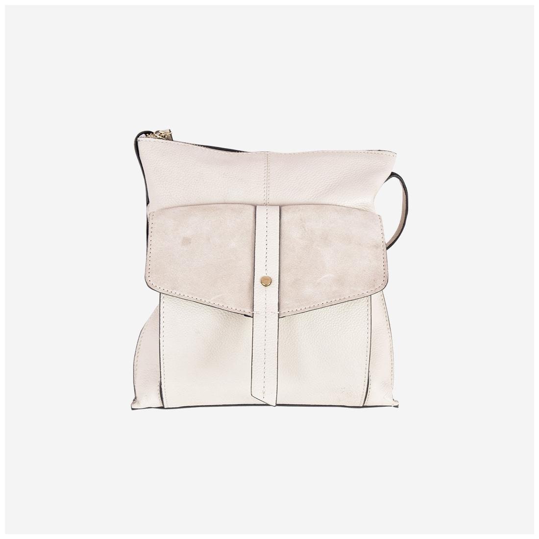 

Umiko Off White Genuine Leather Solid Sling Bag