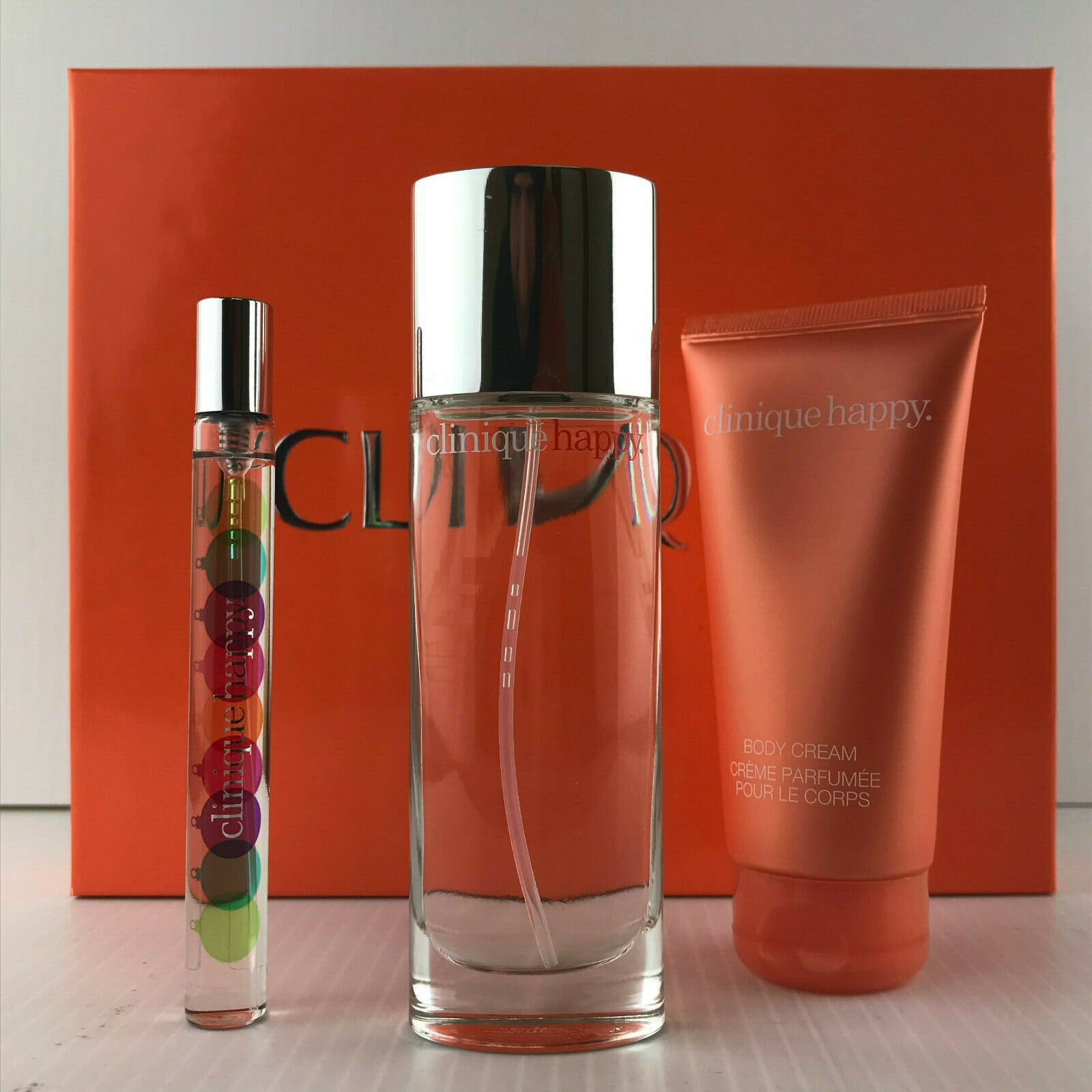 

CLINIQUE HAPPY WOMEN 3PC GIFT SET SPRAY 1 7 OZ BODY CREAM 2 5 MINI SPRAY NIB