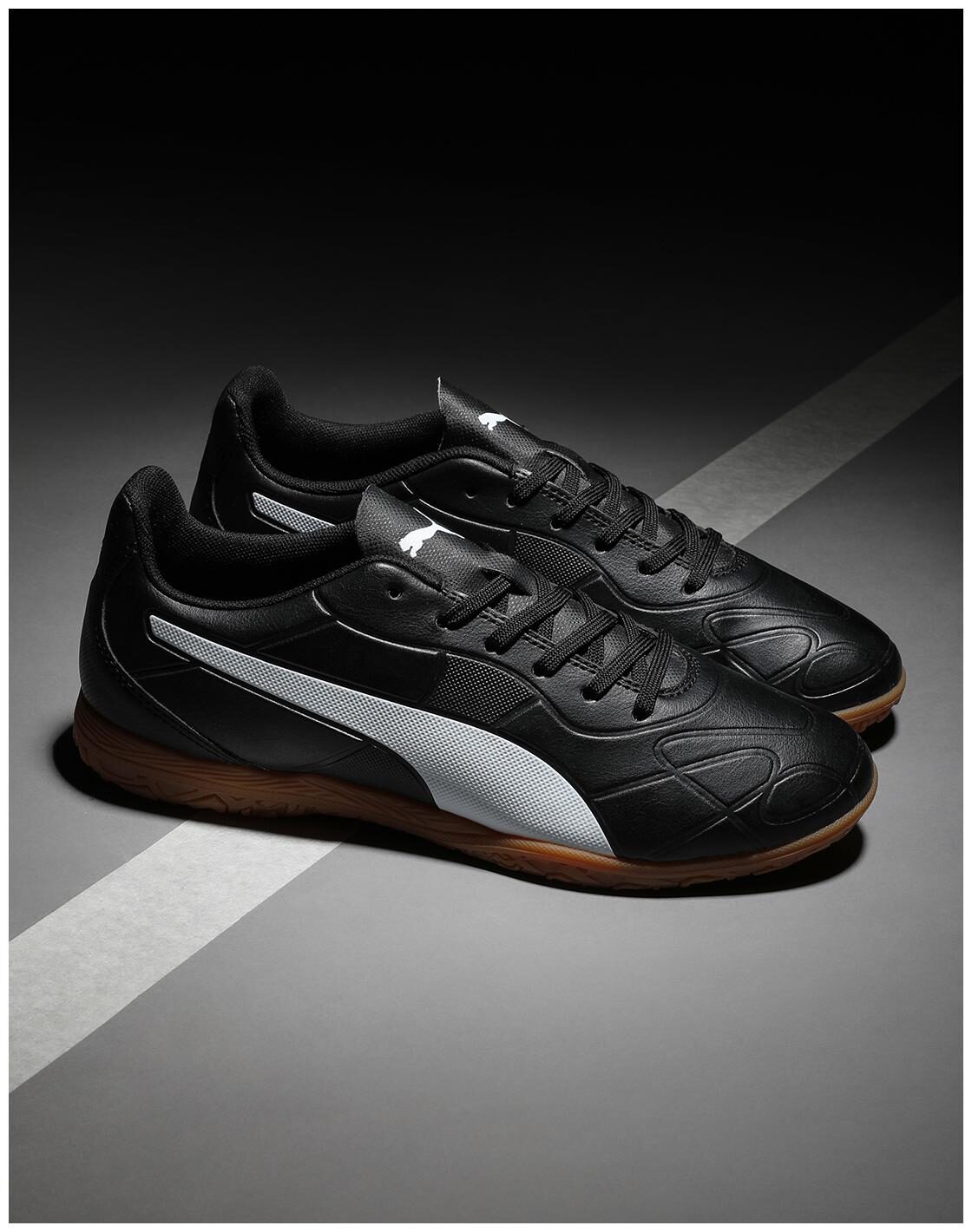 puma black football shoes