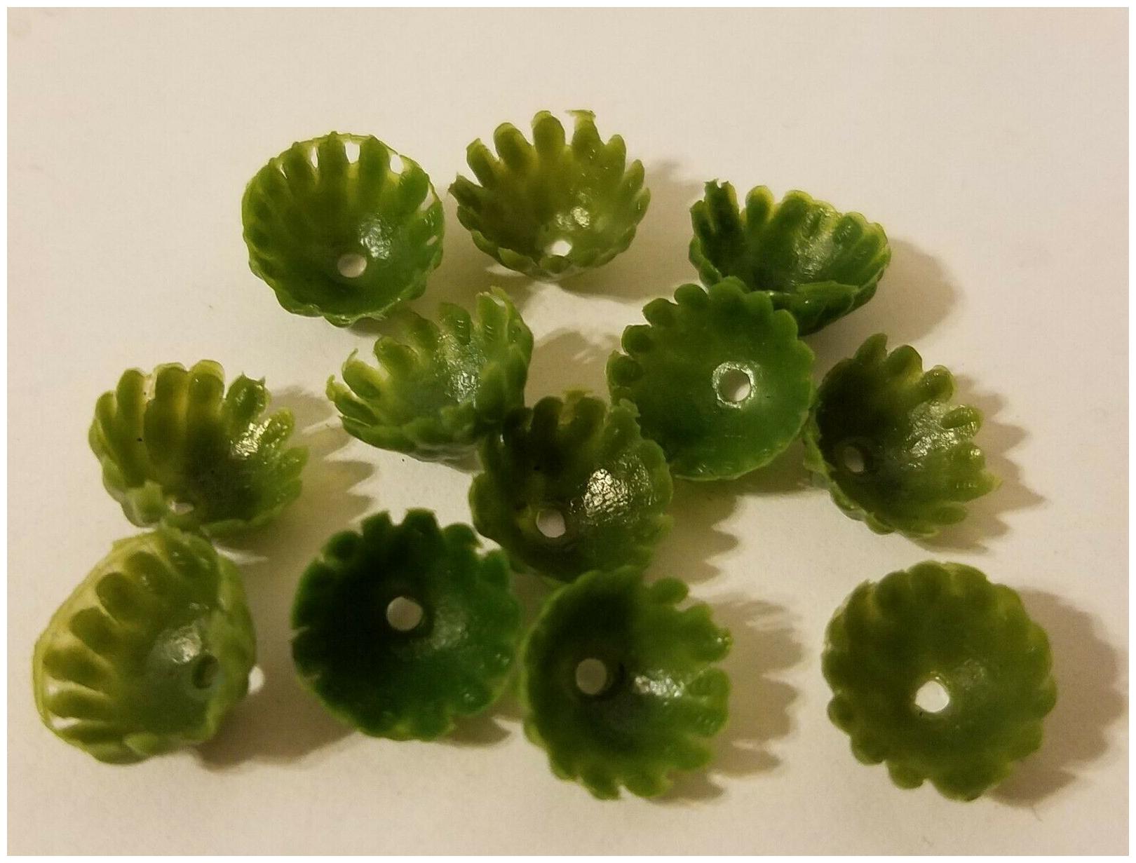 

144 pcs Darice Artificial Green Plastic Mini Flower Blossom Calyx Leaves Floral