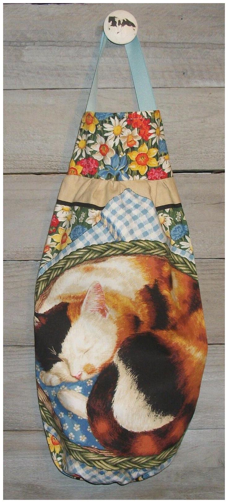 

Calico Kitty Curled up Basket Flowers Plastic Grocery Bag Rag Sock Holder