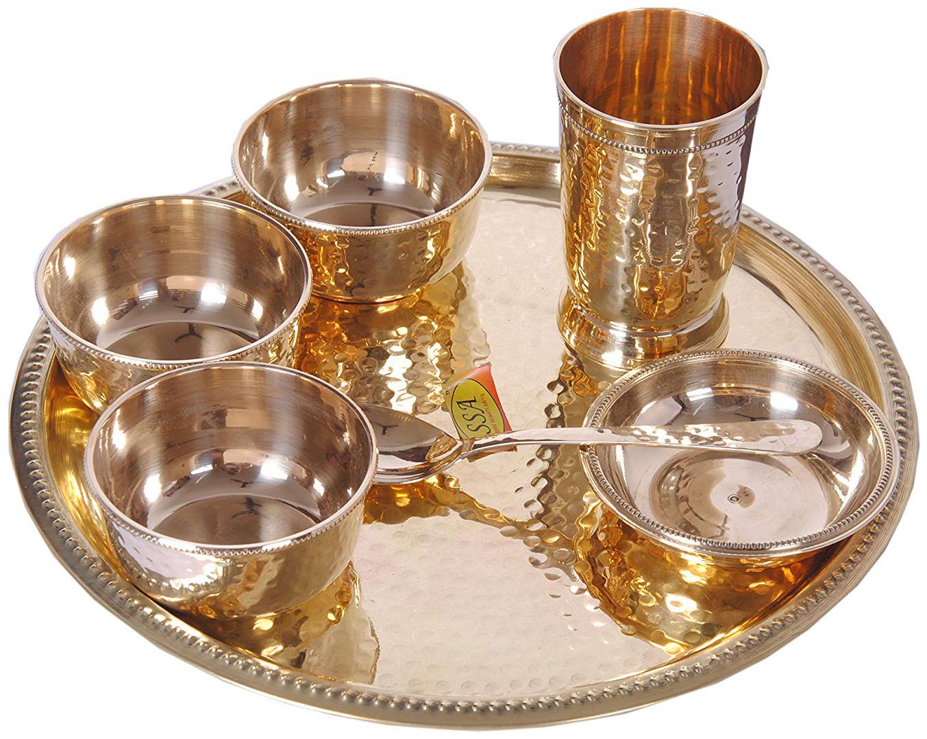 

Shiv Shakti Arts Pure Brass Thali Set 7 Pcs Consist of 3 Brass Bowls 1 Brass Puding Plate 1 Brass Glass 1 Brass Spoon 1 Brass Plate Hammered Designed