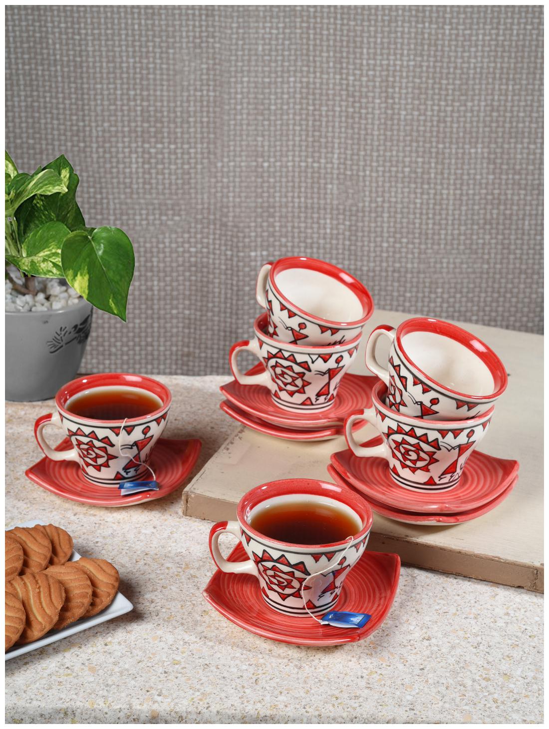 

Tashveen Articles Tea Cups Hand Painted Tea Cup and Saucers Set of 6 ( White with Red Hand Painting in Matte Finish) Coffee Cup Cups and Plate Ceramic Cup and Saucers Tea Set (150 ml)