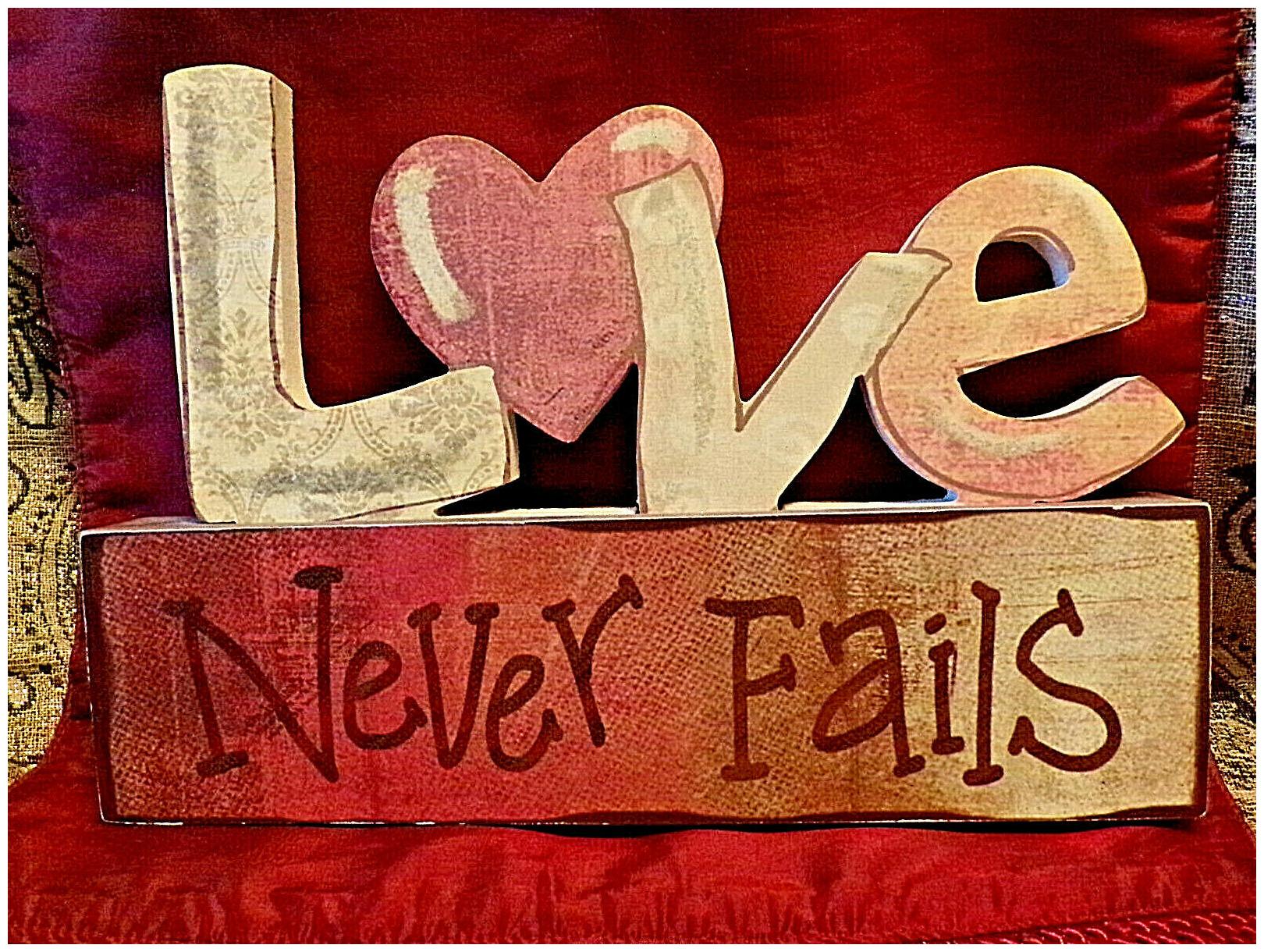 

TOUCHABLE LOVE NEVER FAILS WOODEN PLAQUE 11 1 2 X 8 MADE BY DICKSONS