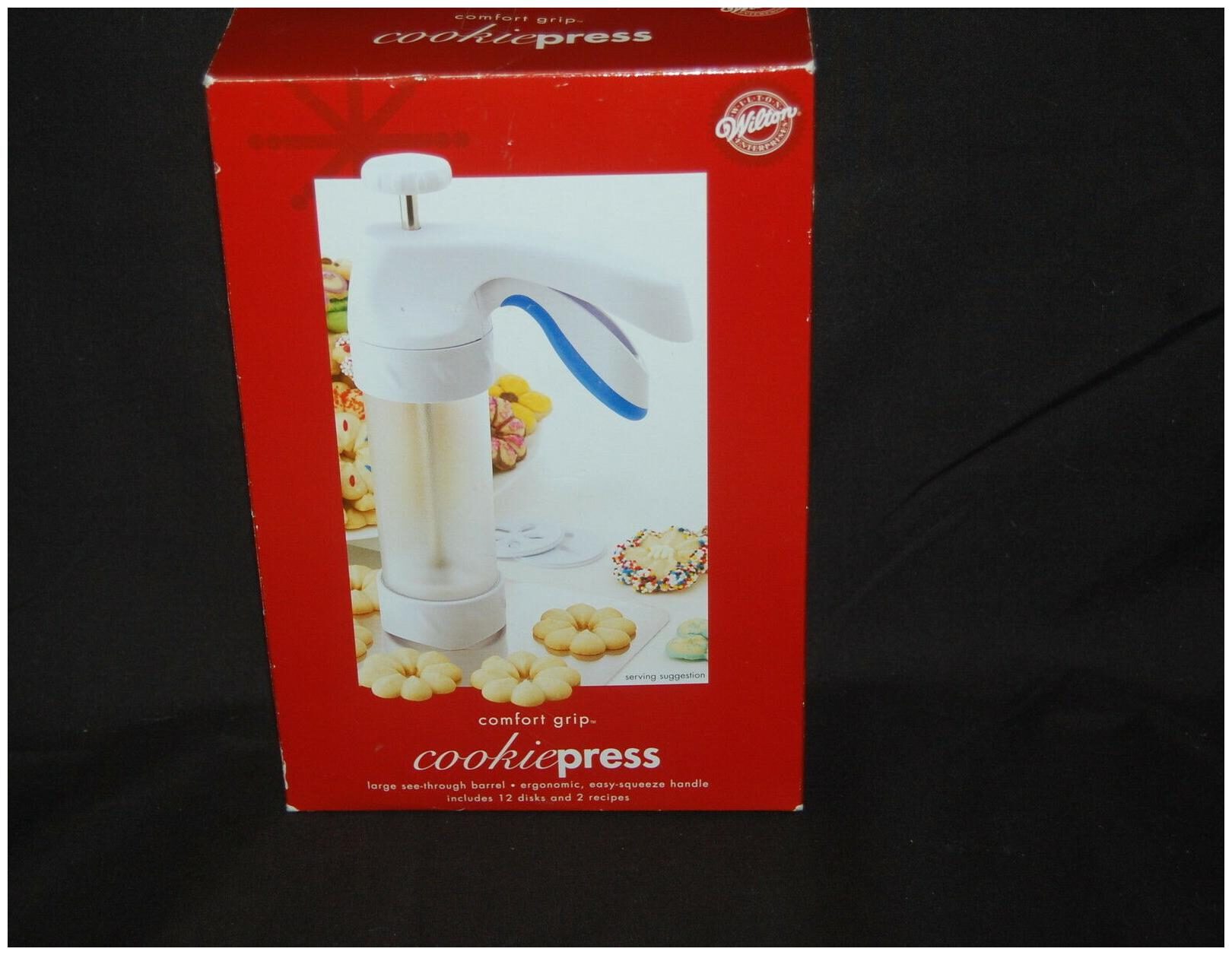 

Wilton Cookie Press Comfort Grip NIB 2004 12 Disks 2 Recipes Clear Barrel