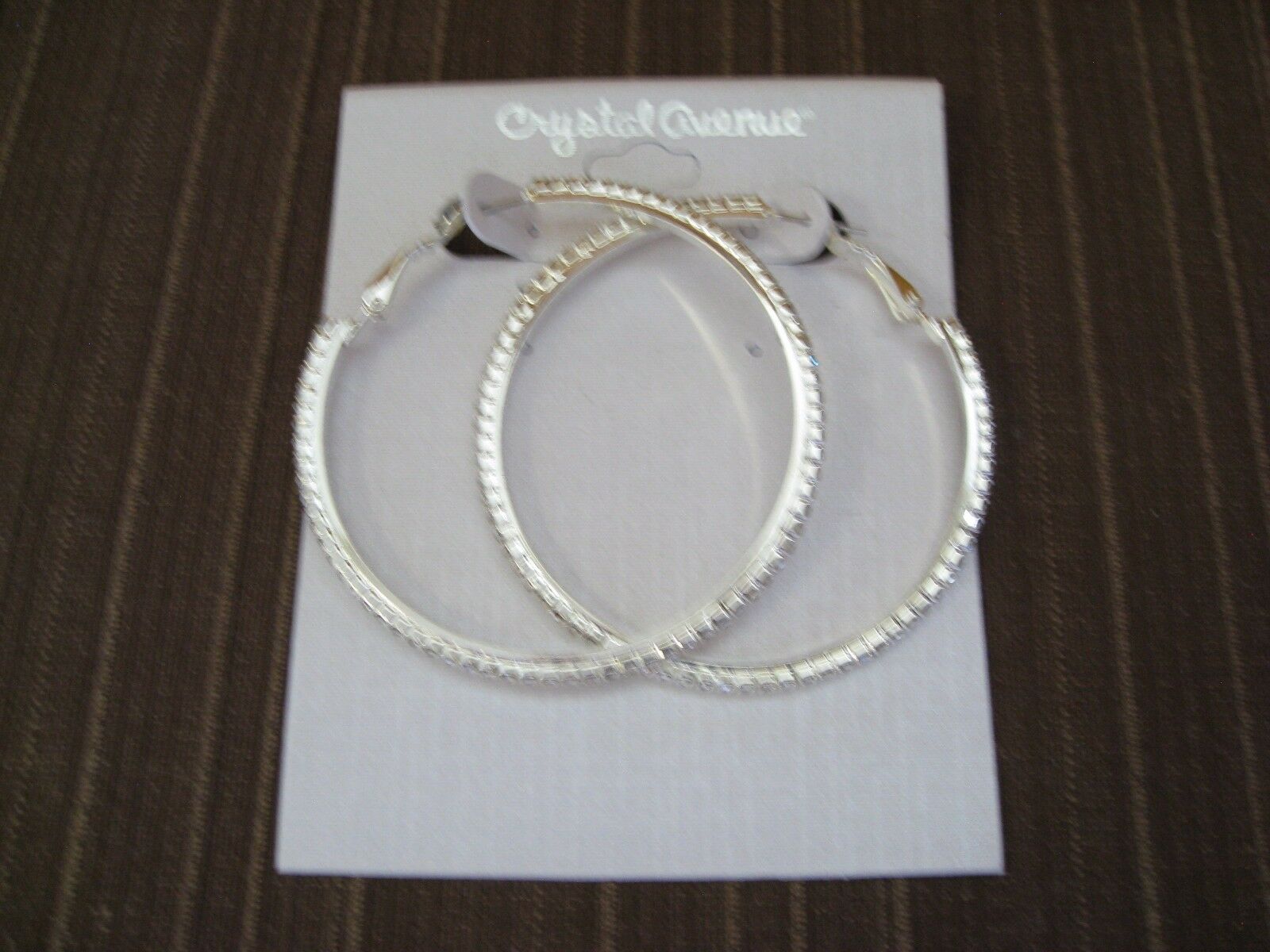

LARGE HOOP PIERCED EARRINGS SILVER TONED METAL AND CLEAR CRYSTAL INLAID 20985