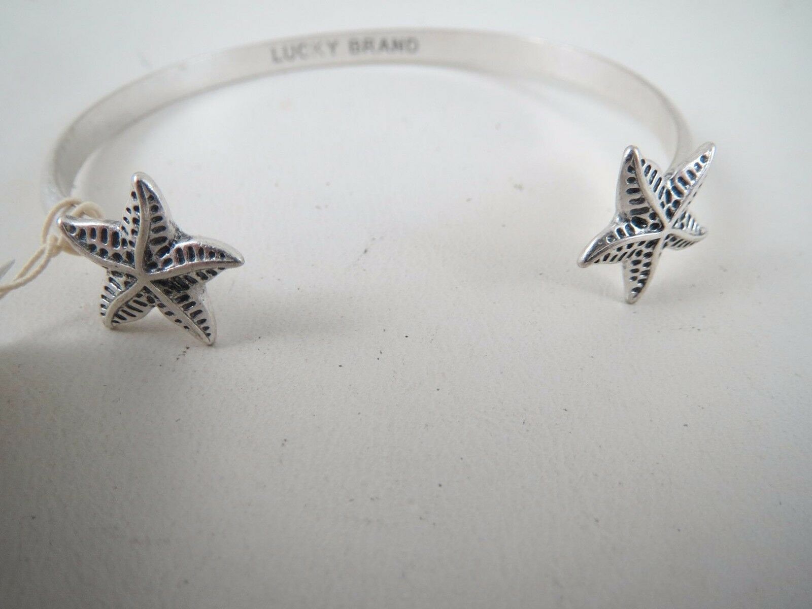 

Lucky Brand silver tone starfish cuff bracelet NWT