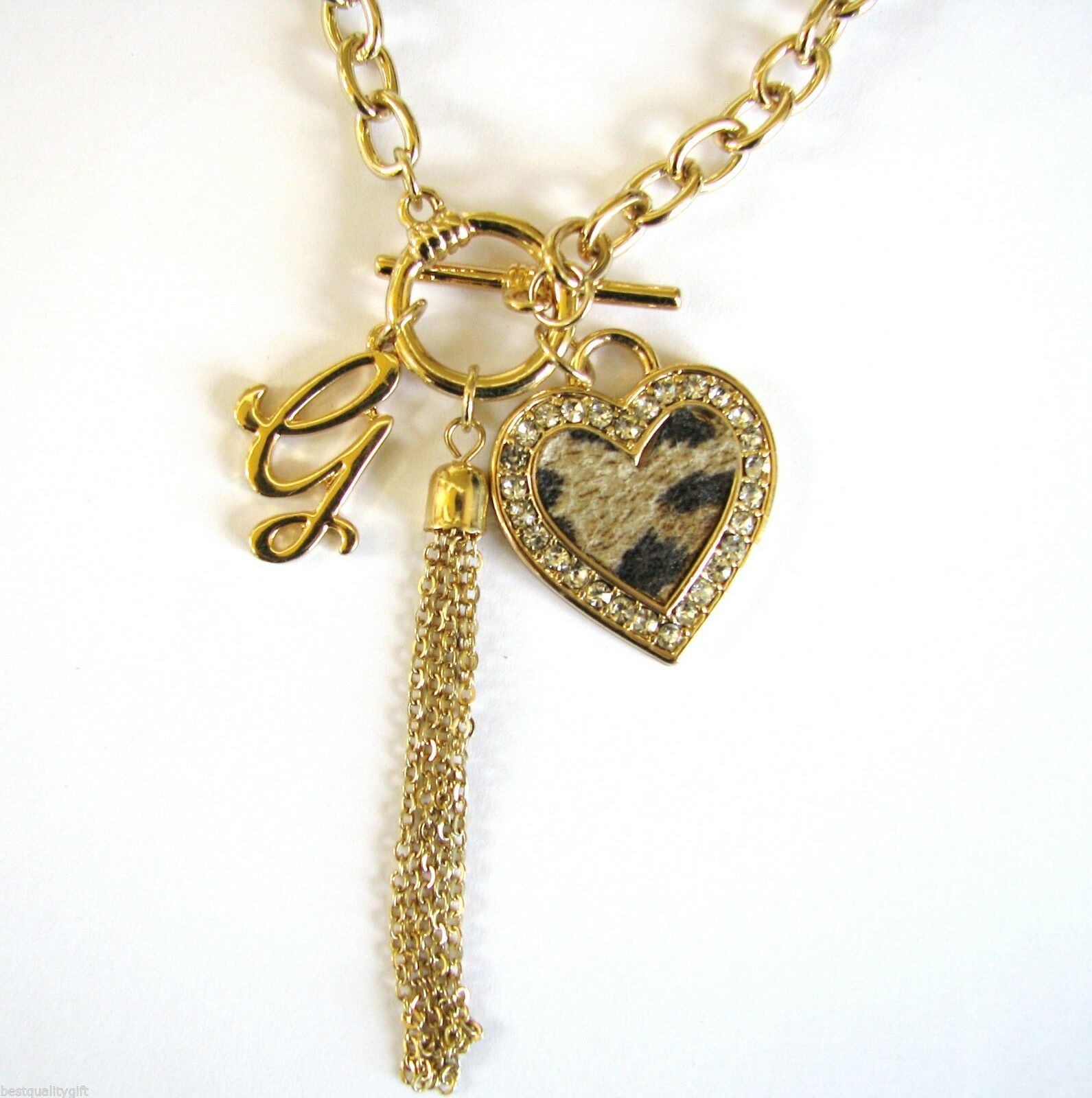 

NEW GOLD TONE G CRYSTAL CHEETAH PRINT HEART MULTI-CHARM TASSEL NECKLACE
