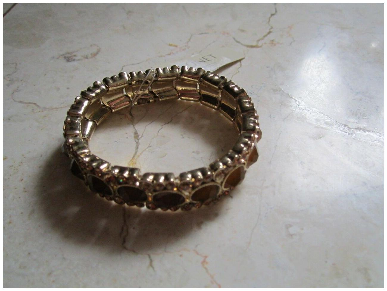 

NEW WITH TAGS MONET TOPAZ COLORED RHINESTONES STRETCH GOLD TONE BRACELET
