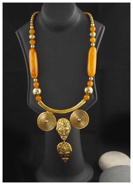 

Niara Antique Gold Orange Color Long Inlay Pendent with Face Detailing Handmade Tribal Festive Jewelry for Women in Traditional Tibetan Design for Daily wear Festive wear Purposes