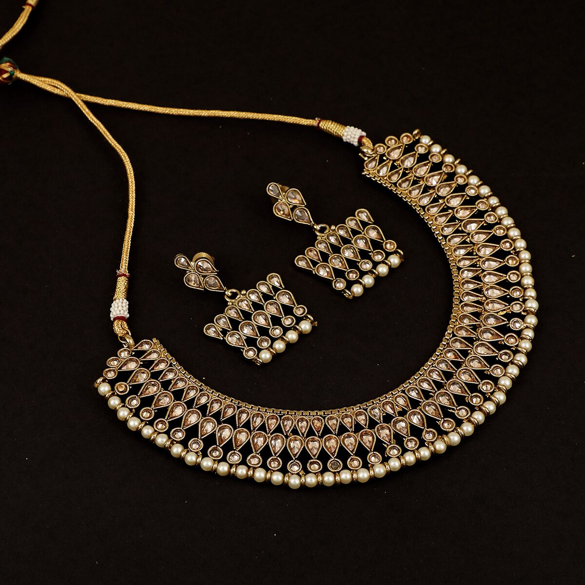 

Piah Fashion Symmetrical Gold Plated Brass Necklace Set With Diamond For Women Girls