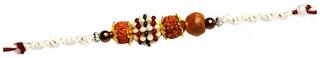 Purvani COMBO of  1 Rakhi /  Rakhi Gift for Brother with Rakhi Card & Roli Chawal / Pearl / Crystal rakhi