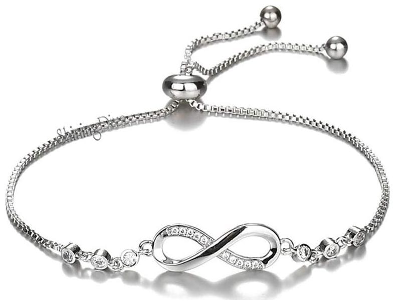 

Shining Diva Fashion Infinity Crystal Charm Silver Plated Bracelet for Women and Girls (Silver) (10672b)