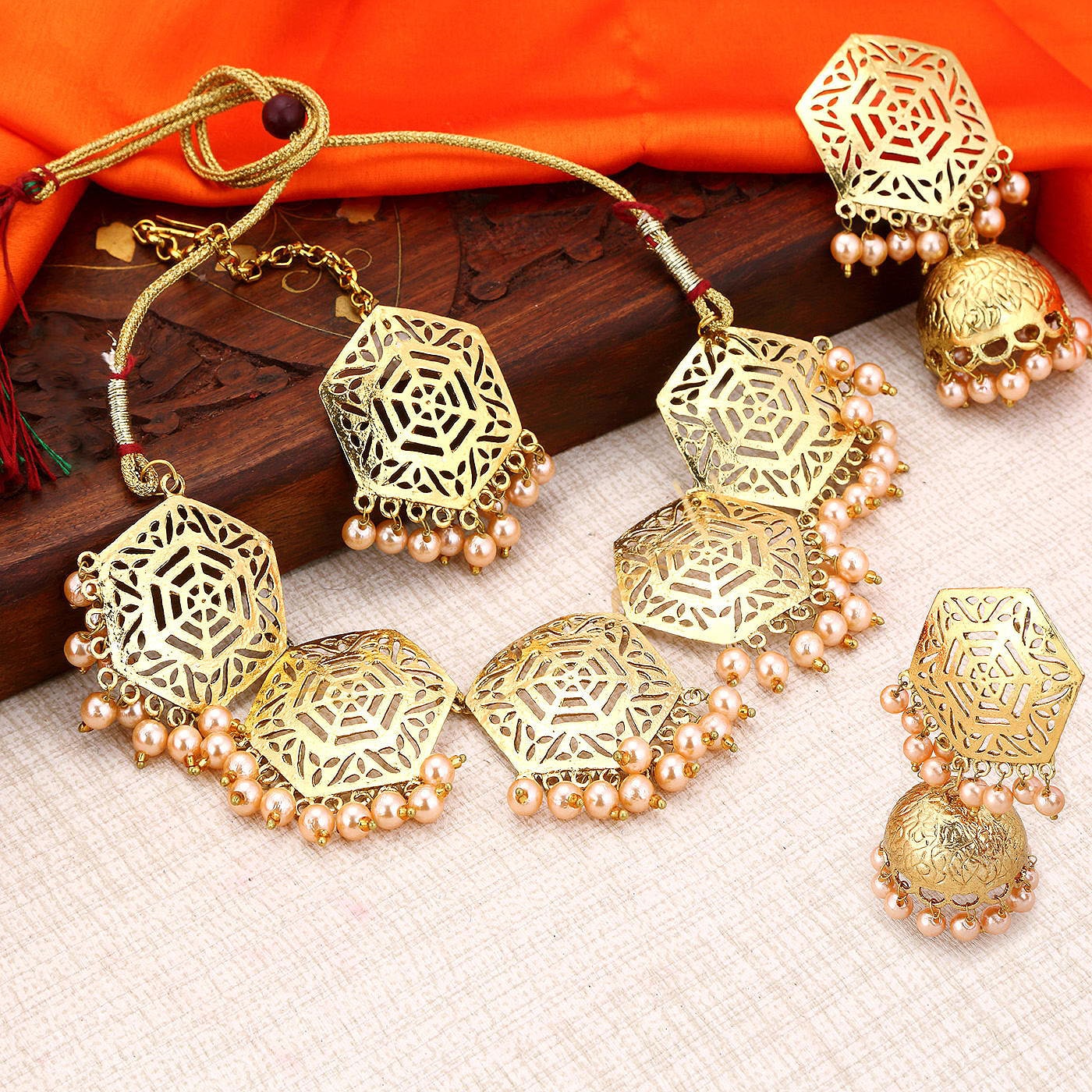 

Sukkhi Hexagon Designer Gold Plated Wedding Jewellery Pearl Choker Necklace Set For Women