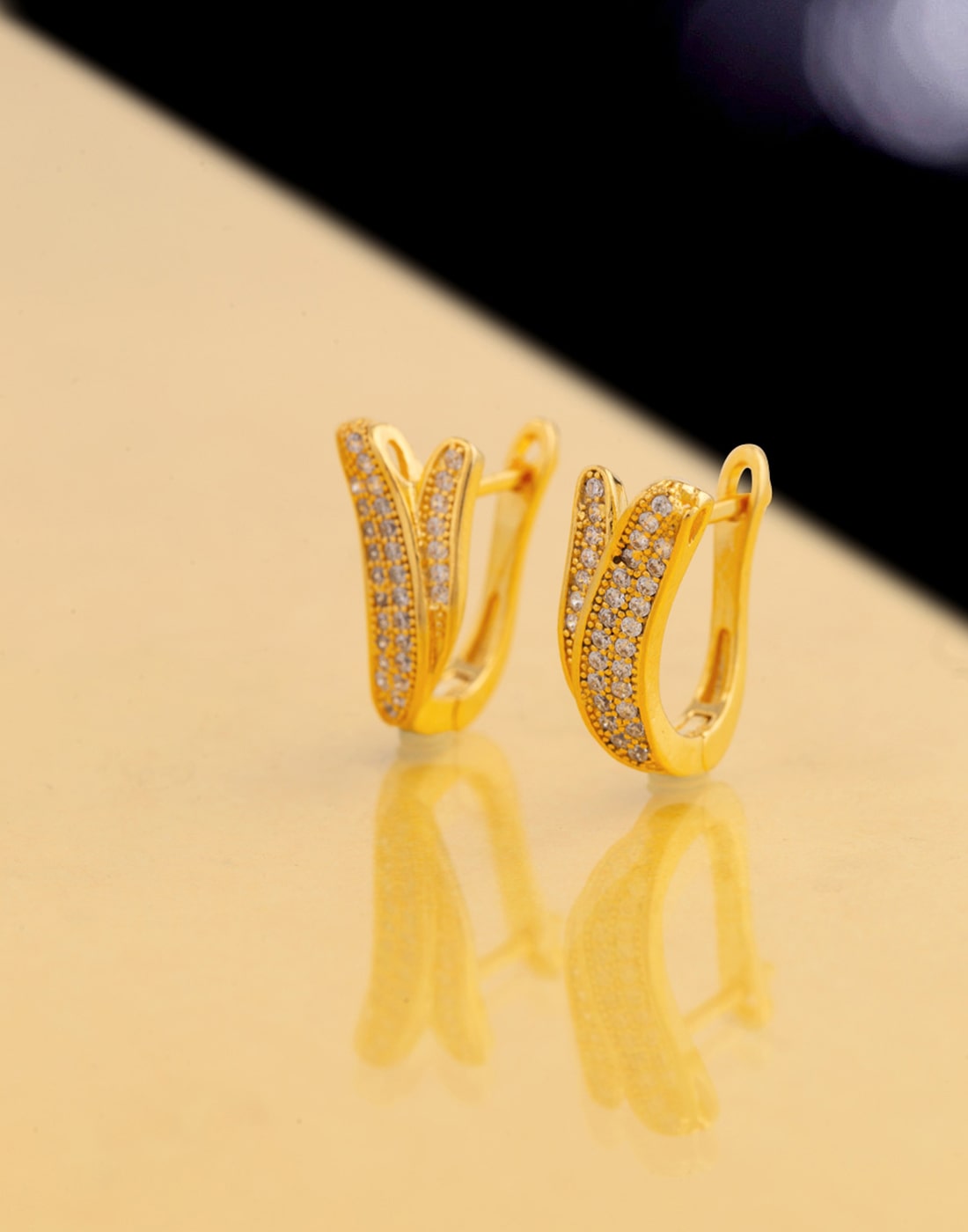 

Voylla Gemstones Studded Brass Work Wear Earrings