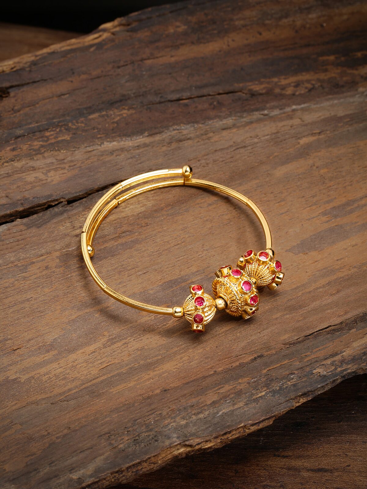 

Zaveri Pearls Gold Tone Wraparound Style Contemporary Brass Kada-ZPFK9216